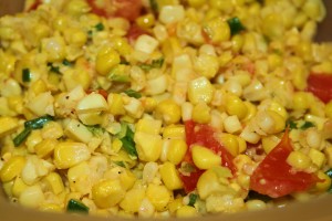 Summer Corn Salad Sweet corn salad with tomato and green onions sauteed in butter