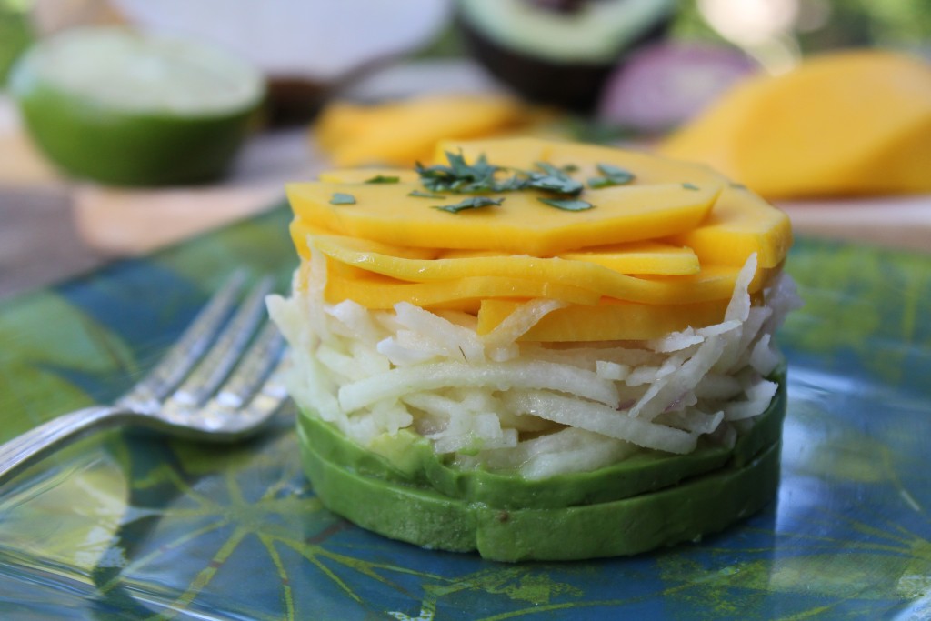 stacked mango avocado and jicama salad with cilantro