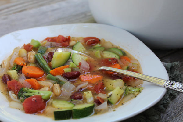 Summer vegetable harvest in a bowl with Easy Minestrone Soup